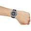Wrist wearing a Casio watch on a white background