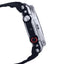 Close-up of a black and silver watch with a red button on a white background