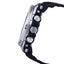 Close-up of a black and silver watch with a detailed band design on a white background